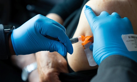 flu-shot-nurse-hands-injection 